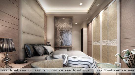 在床尾处衣柜以不同的材质变化同一水平面的墙面层次。