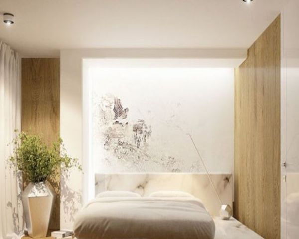 米白色一体的大理石床架，很好的和白色墙面以及裸色木制地板相融合，瞬间提升了空间的整体感。 