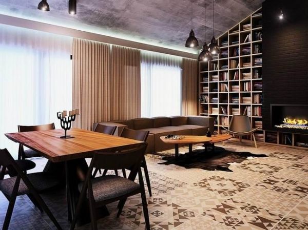 Edo Design Studio带来的阁楼公寓，高高的天花板，整面的书架从地板直通混凝土天花板，咖啡色的沙发和餐椅，配上木质的质朴，深色调的客厅让人大感工业风的魅力，衣帽间巧妙的安排在了阁楼一角，三间卧室三种风格，或是素雅带着未来感，或是充满热情暖意十足，各种魅力一一散发！