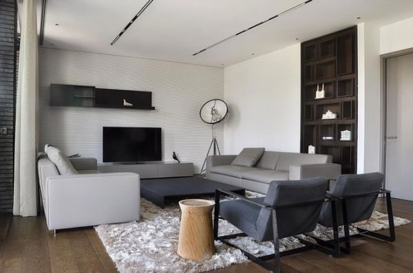 这个时髦的复式公寓位于塞尔维亚贝尔格莱德，由设计师Aleksandar Savikin操刀完成。这栋复式公寓占地面积217平方米，有公共客厅区域,餐厅,一个厨房和一个酒吧,功能区齐全，还有一个大大的阳台。整个室内设计采用黑灰色调，同事搭配匹配的家具软装，整个空间稳重、大气、简洁。