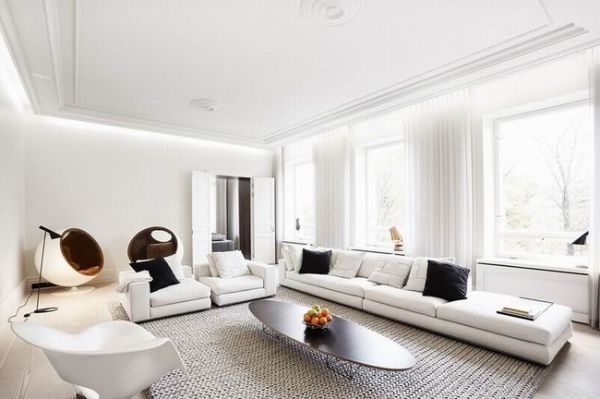 这间现代公寓位于加拿大多伦多，整间公寓充满现代设计感，简洁、大方。天花板和部分墙面保持了原始的混凝土墙面，其余部分用白色涂料进行覆盖，白色的墙面与粗糙的混凝土墙面结合在一起，非常的有特色。