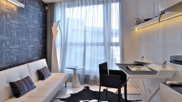 这套时尚度极强的公寓设计不拘一格，它拥有特殊的集成照明系统，让你感觉室内充满神秘感。公寓的设计充满活力。家具选择主题追求一简约而不简的。卧室相当宽敞。在每个家具的背后，都装有LED灯。在客厅中间的有一个迪斯科样式的圆形地毯和一个甜美的全白色圆桌。