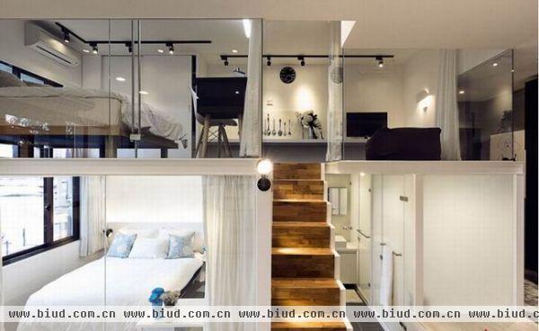 这个52平米的小阁楼公寓位于台湾新北市中和区，准备是姐妹两人的共同生活空间，设计公司将这个仅有52平米的空间未姊妹两人分别划分了各自的空间，以居中的方式让空间看起来更有舞台版场景的视觉效果。