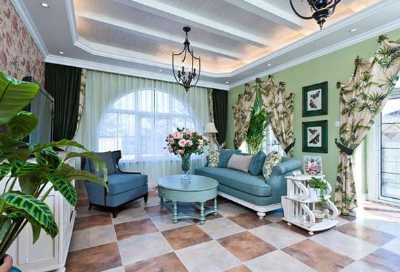 本案是一套混搭的美式田园风格的别墅案例，空间内较多的使用蓝绿色及铁艺等充满田园气息及美式风格的元素，营造一种闲适、清新的居住环境。设计师混搭入较多地中海风格的装饰，在闲适中增加一抹沉静，客厅里几株绿植配上蓝绿色的沙发，为空间增添了观赏性，室内的家装充分体现了美式乡村风格的精髓。
