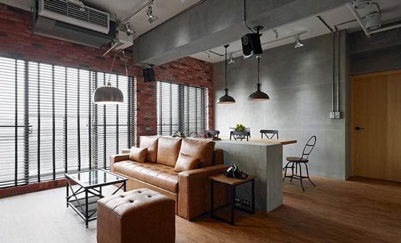 年轻人的公寓可以充满无数的可能性，这座位于高雄的公寓面积约为93平米，从基本的工业风元素开始，清水混凝土，特意定制的黑色铁件柜体，复古的配饰，裸露的红色砖墙，不仅如此，还利用皮革沙发，木质元素，和部分鲜亮的色彩塑造空间的层次感，个性又独特。