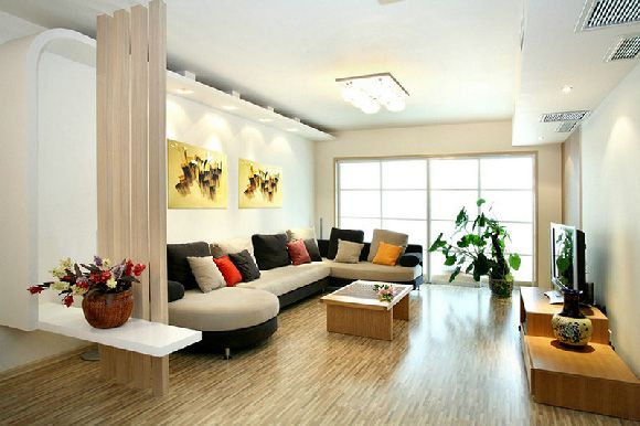 弧形墙面造型配上灰白的布艺沙发，在客厅空间成为一道风景线。