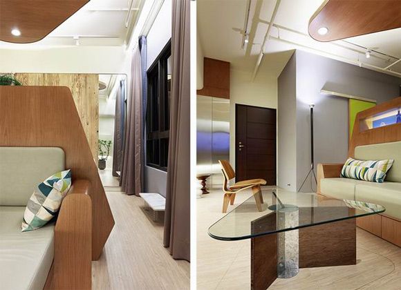 33平米的公寓需要满足完善的生活功能，设计师认为小面积的功能空间不应该分散开，这样会让空间变得更加拥挤，而是应该进行集中规划，打造一个大型木质家居，一面摆放沙发，作为家中休憩之地，而另一面则进行双重划分，作为工作空间和卧室，像百宝箱一般，需要时便可使用，木质空间让这个充满创意的家变得十分有趣。