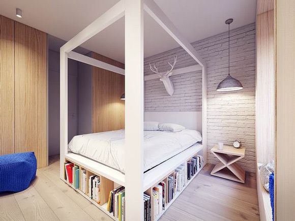 波兰华沙这座60平米的公寓由PLASTE[R]LINA设计，一室一厅的空间用白色打底，以烟灰色和黑色进行搭配，每件家具的选择都十分的用心，为了节省面积，客餐厅用中岛隔离，并刻出空间放以书籍，现代空间有了文化的气息，卧室的床架也延用这个方法，空间十分得体。