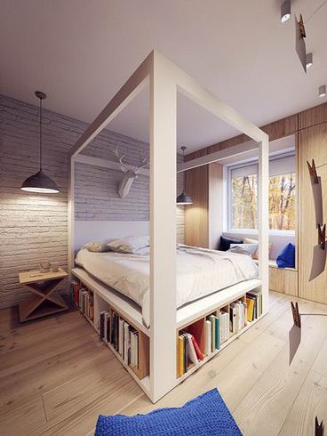 波兰华沙这座60平米的公寓由PLASTE[R]LINA设计，一室一厅的空间用白色打底，以烟灰色和黑色进行搭配，每件家具的选择都十分的用心，为了节省面积，客餐厅用中岛隔离，并刻出空间放以书籍，现代空间有了文化的气息，卧室的床架也延用这个方法，空间十分得体。