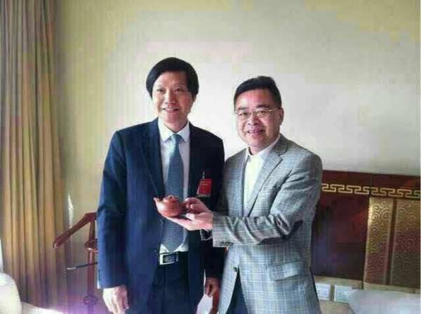 唯美集团总裁黄建平（右）与小米雷军