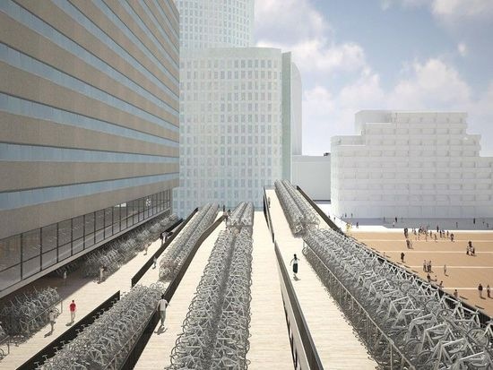 在一个自行车比居民数量还要多的国家里，计划在海牙中央车站增加供6000辆自行车停放的车位。该项目将由荷兰 NL 建筑事务所负责， NL 曾经参与了在荷兰不同地方的一体式自行车停车设计项目。海牙火车站正在进行转型，要打造一个现代化的交通枢纽。位于KJ plein广场的新 停车棚 将设在车站的新入口处，并且根据他们经常使用自行车作为代步工具的女王的名字命名。入口通道和主要的自行车存放处结合在一起，停车棚设想为鼓励和欢迎游客使用，同时能增加这个空间的使用人数。