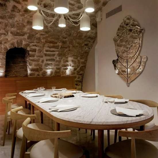the private dining room seats 10 diners at a chef’s table that is illuminated by a chandelier designed by hayon